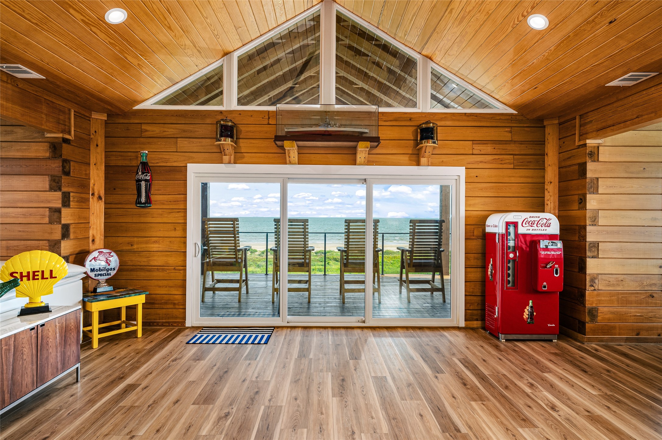 342 Atkinson Street Crystal Beach, TX 77650 - Photo 32 of 50 a view of a house with porch and wooden floor