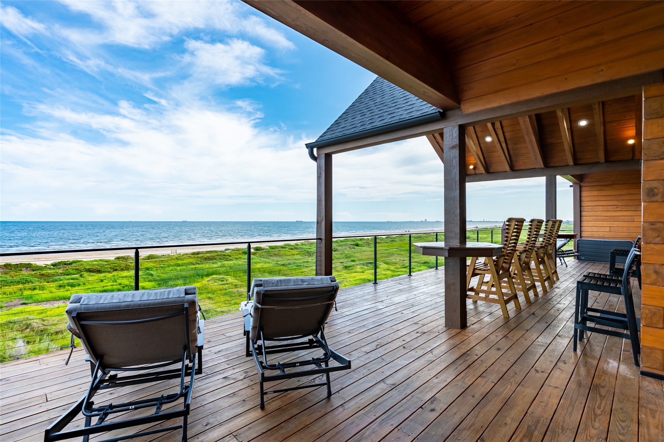 342 Atkinson Street Crystal Beach, TX 77650 - Photo 35 of 50 a view of a chairs and table on the deck