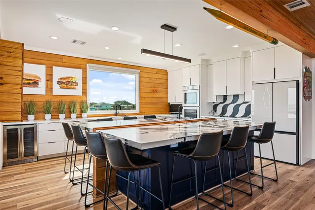 a dining table with chairs and window