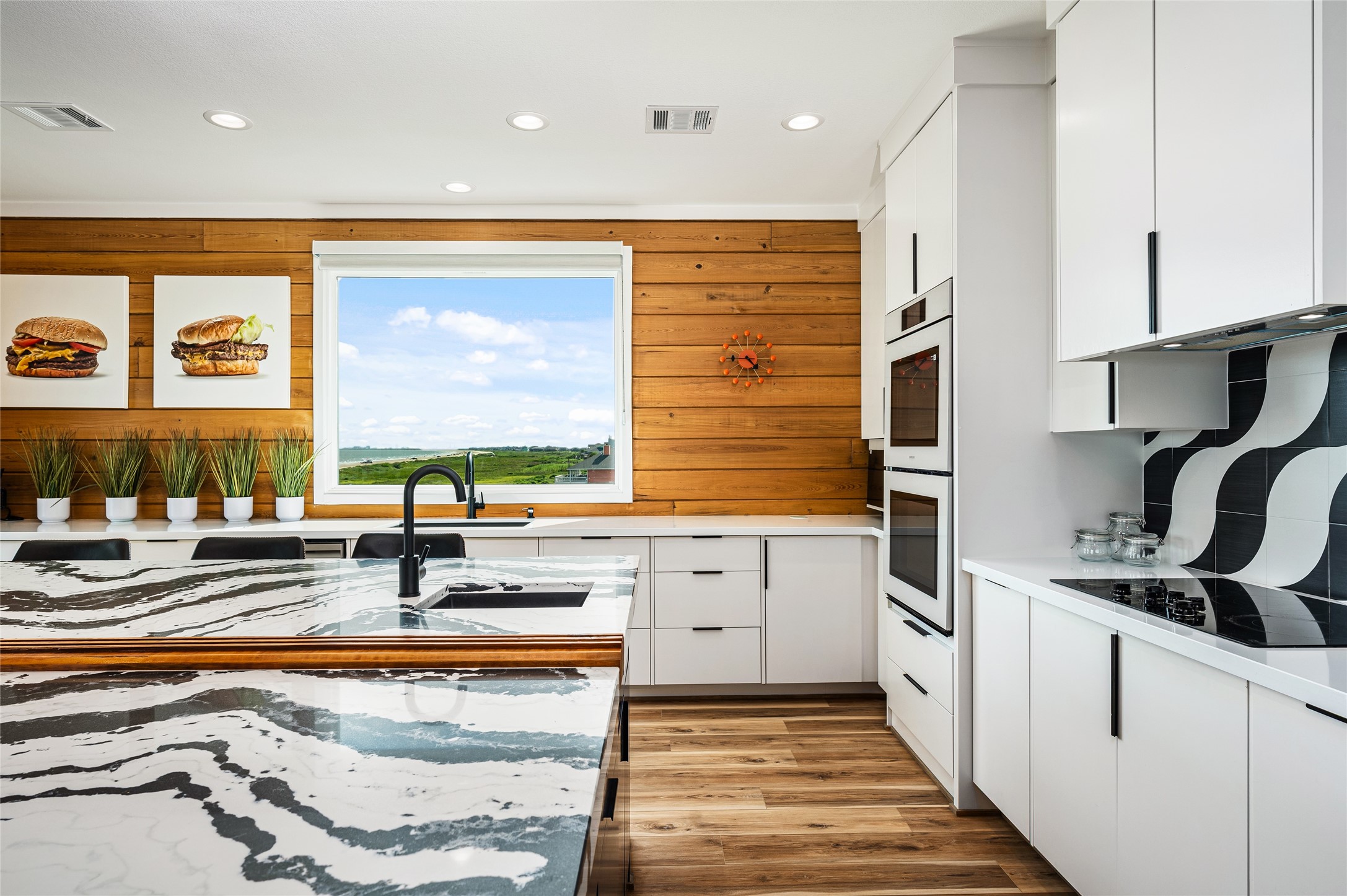 342 Atkinson Street Crystal Beach, TX 77650 - Photo 41 of 50 a kitchen with stainless steel appliances a stove a sink and a refrigerator