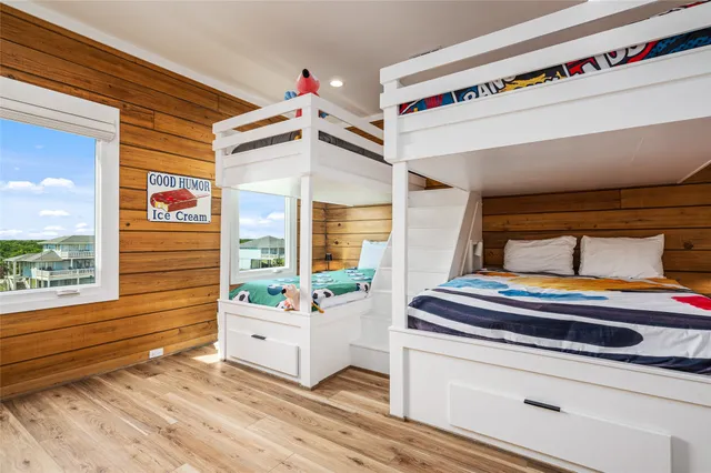 a living room with a bed and a window