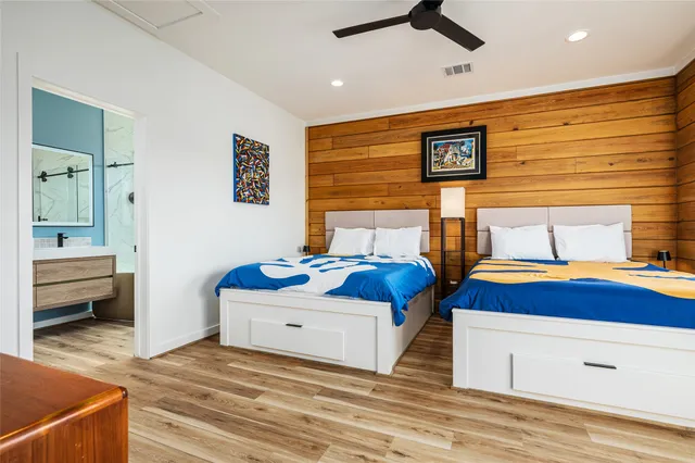 a bedroom with bed and balcony