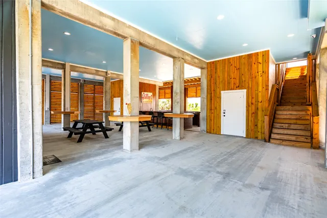 a view of room with furniture and floor to ceiling window