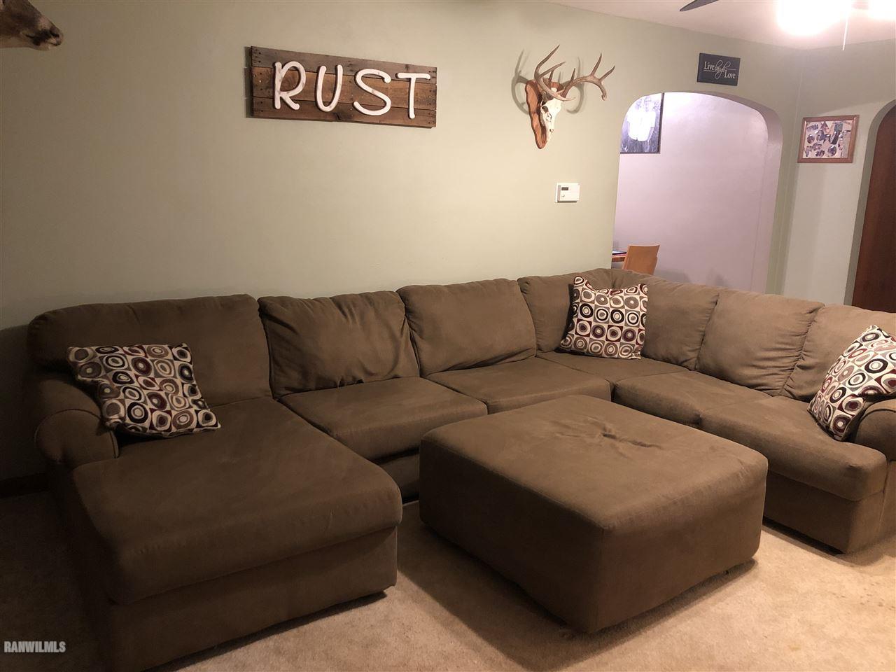 1883 East Currier Road Freeport, IL 61032 - Photo 11 of 36 a living room with furniture and a couch
