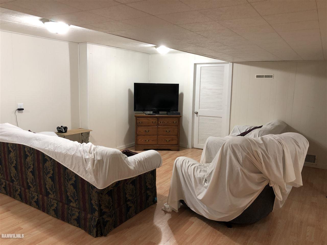 1883 East Currier Road Freeport, IL 61032 - Photo 23 of 36 a bedroom with bed and a flat screen tv