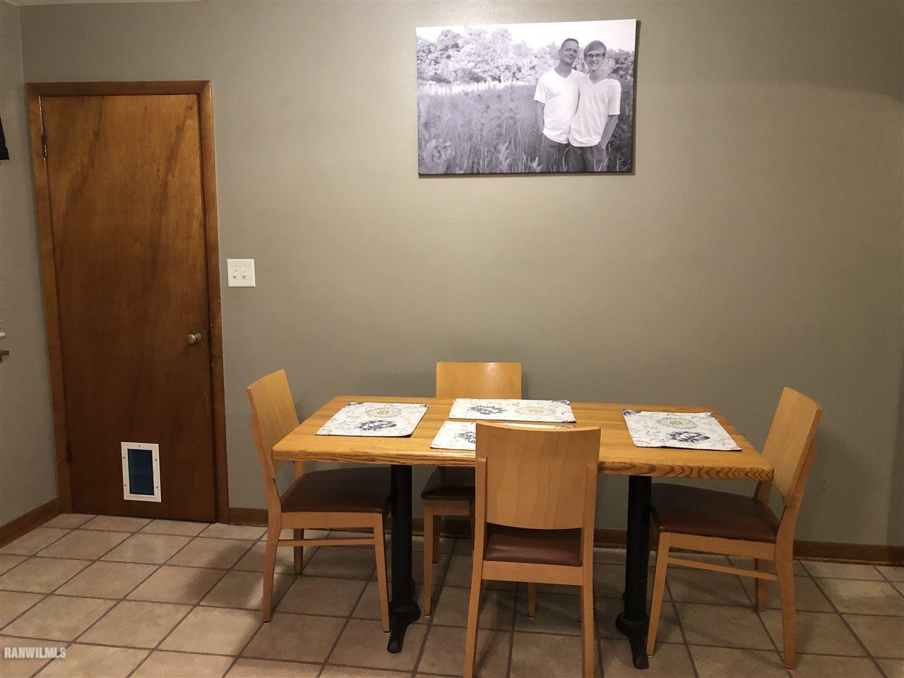 1883 East Currier Road Freeport, IL 61032 - Photo 7 of 36 a view of a dining room with furniture and a table