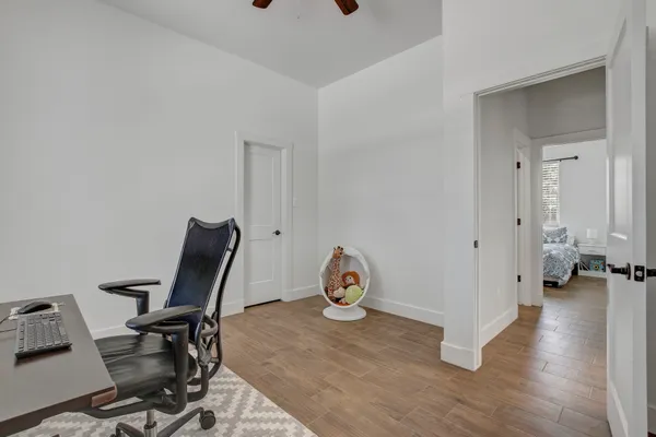 a large kitchen with granite countertop a large counter top a sink stainless steel appliances and cabinets