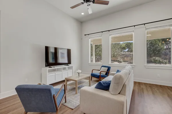 a living room with furniture and a large window