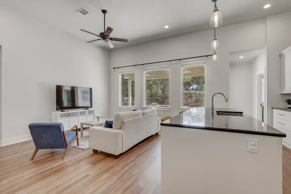 a bedroom with a bed and a ceiling fan