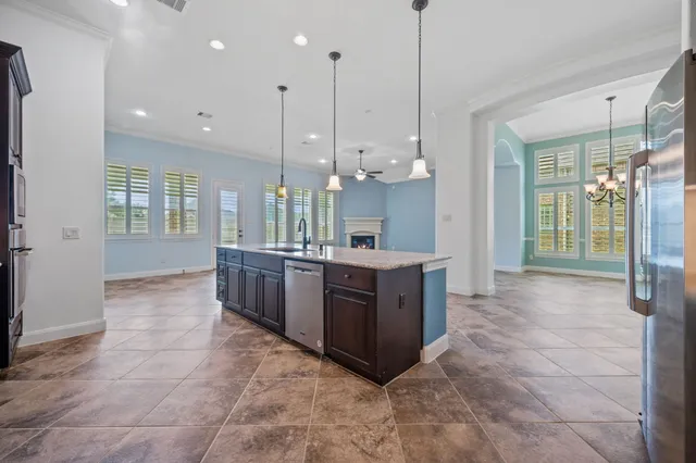 a large bathroom with a large tub and sink