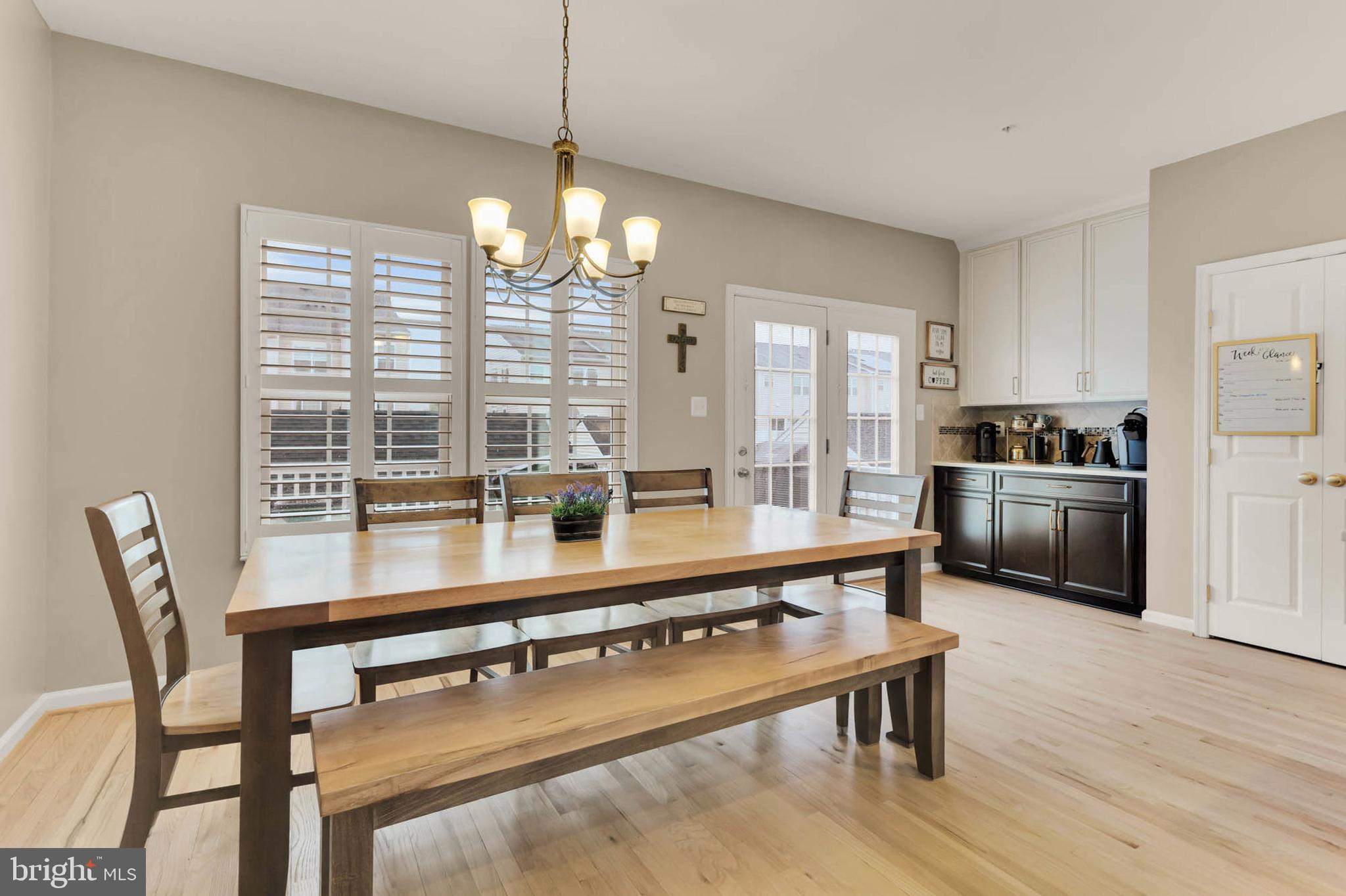 6367 Walcott Lane Frederick, MD 21703 - Photo 13 of 43 a room with stainless steel appliances kitchen island granite countertop a dining table chairs and granite counter tops