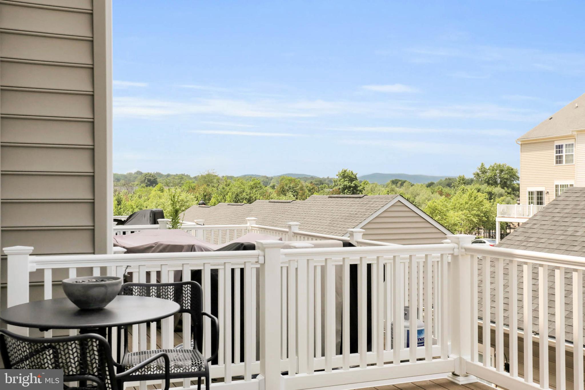 6367 Walcott Lane Frederick, MD 21703 - Photo 15 of 43 a balcony with table and chairs