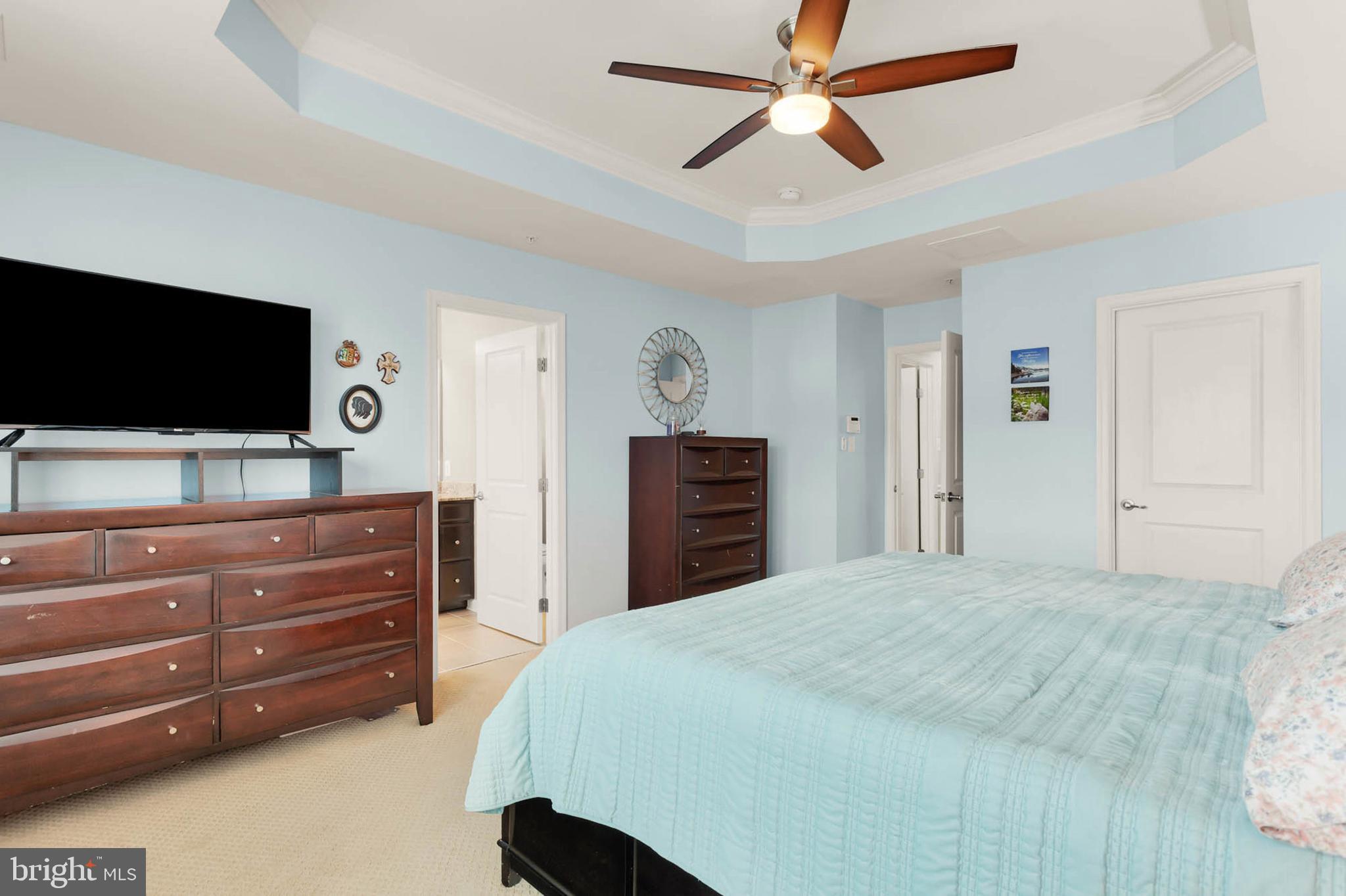 6367 Walcott Lane Frederick, MD 21703 - Photo 17 of 43 a bedroom with a bed and a flat screen tv