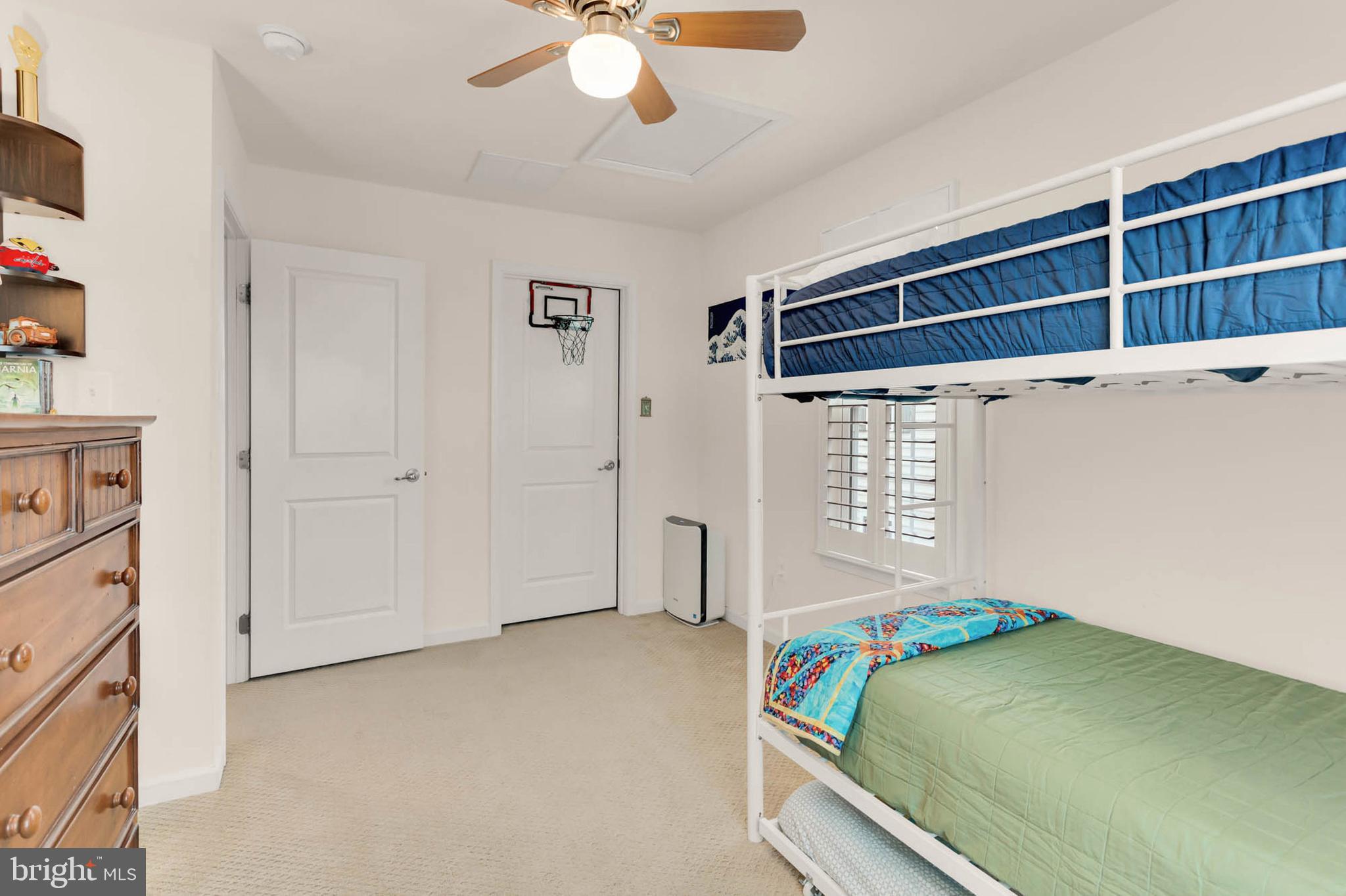 6367 Walcott Lane Frederick, MD 21703 - Photo 23 of 43 a bedroom with a bed and a chandelier