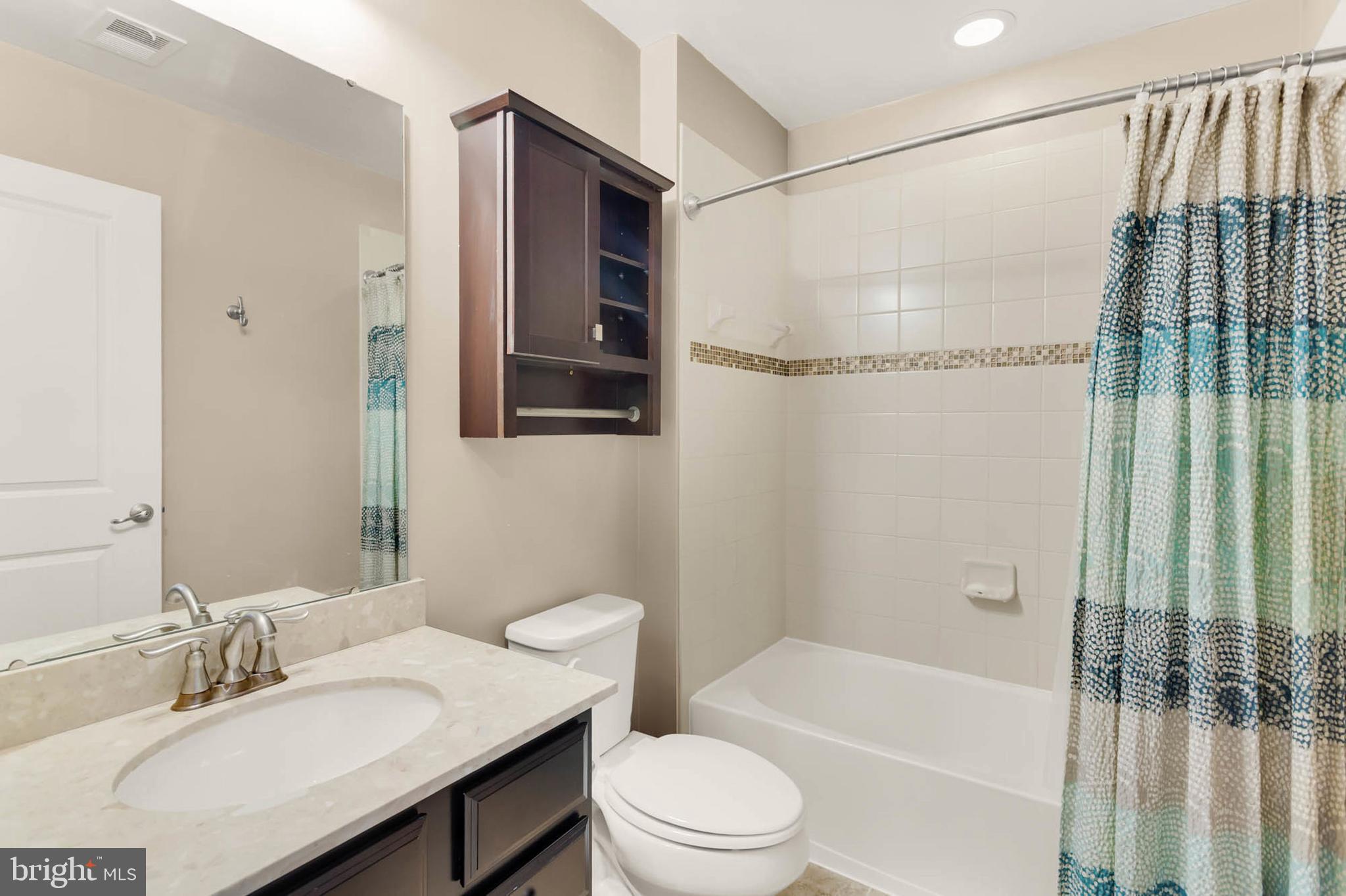 6367 Walcott Lane Frederick, MD 21703 - Photo 24 of 43 a bathroom with a sink toilet and shower