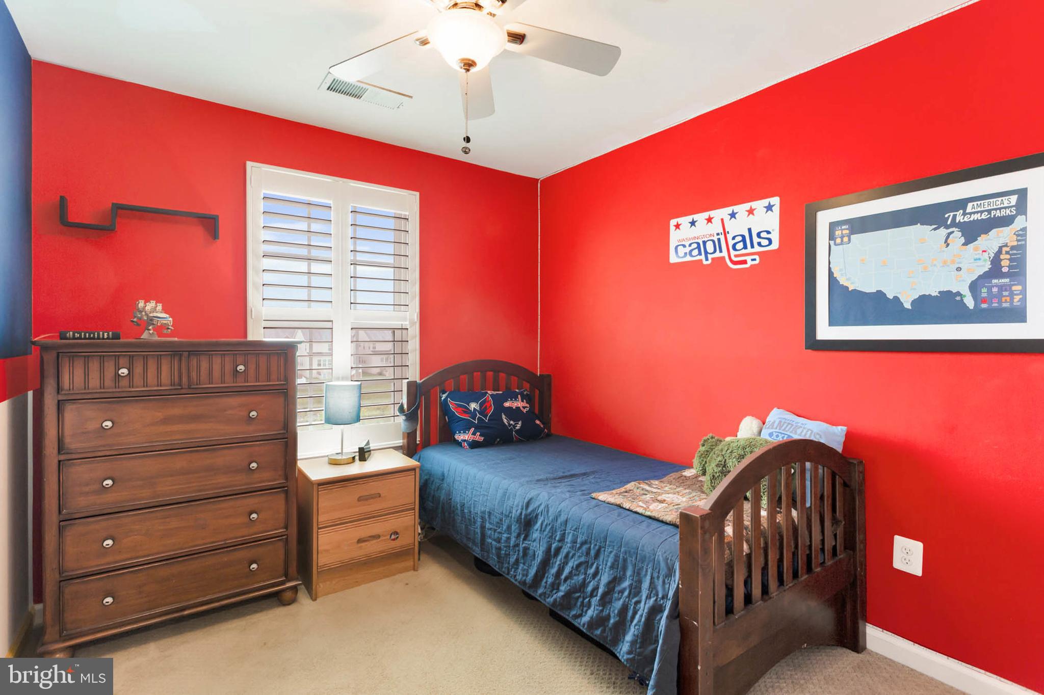 6367 Walcott Lane Frederick, MD 21703 - Photo 25 of 43 a bedroom with a bed and a chandelier