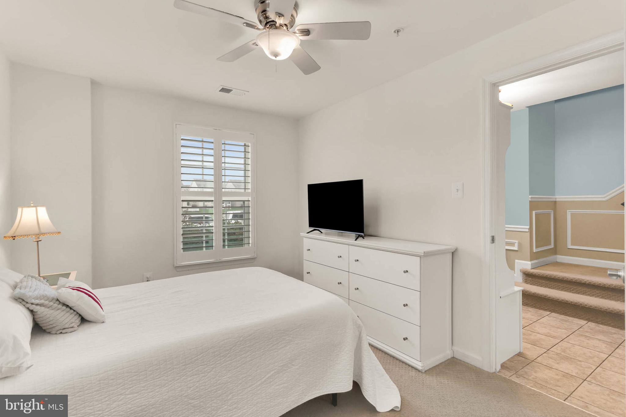 6367 Walcott Lane Frederick, MD 21703 - Photo 28 of 43 a bedroom with a bed and a flat screen tv