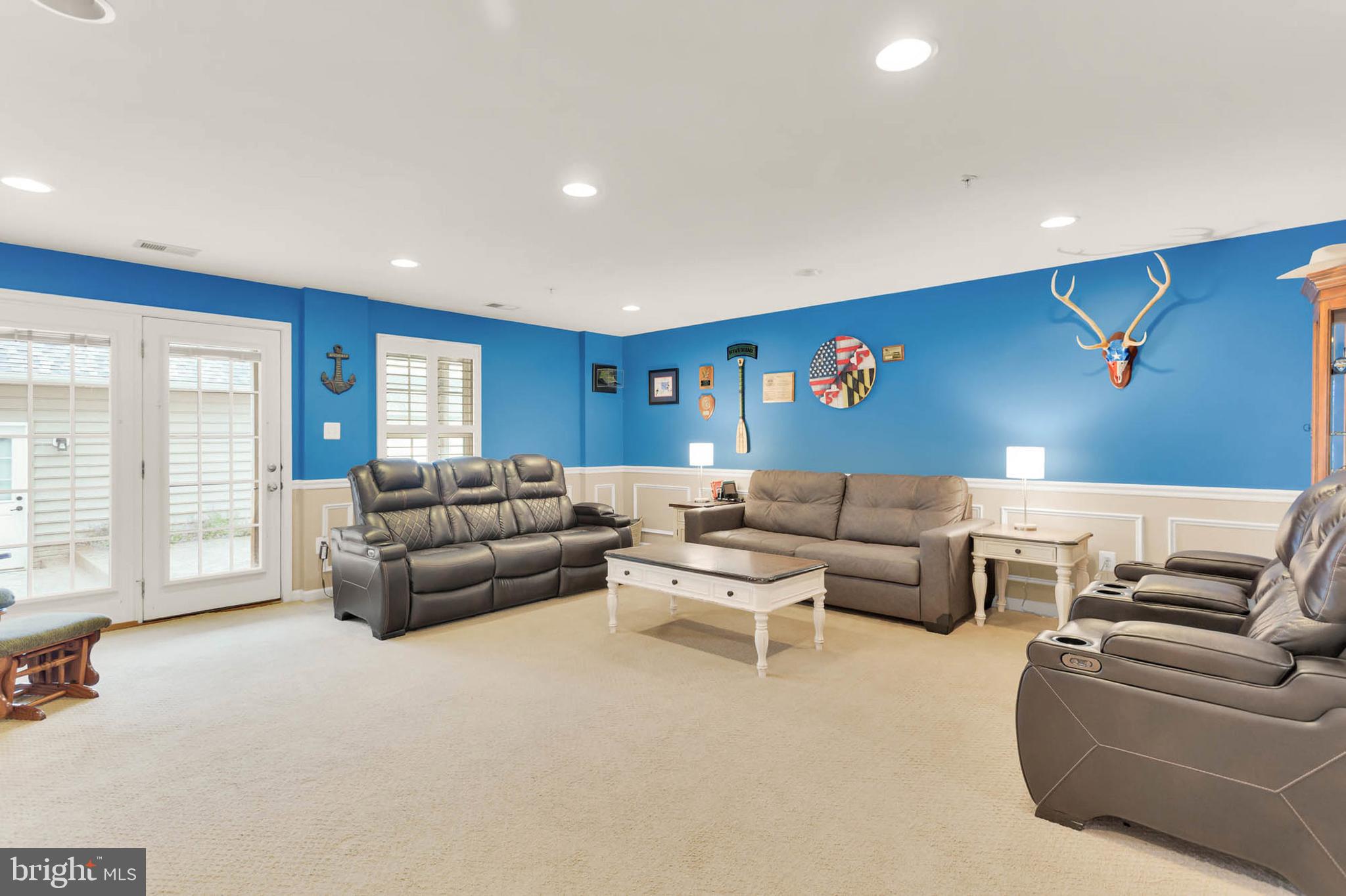 6367 Walcott Lane Frederick, MD 21703 - Photo 30 of 43 a living room with furniture and a flat screen tv