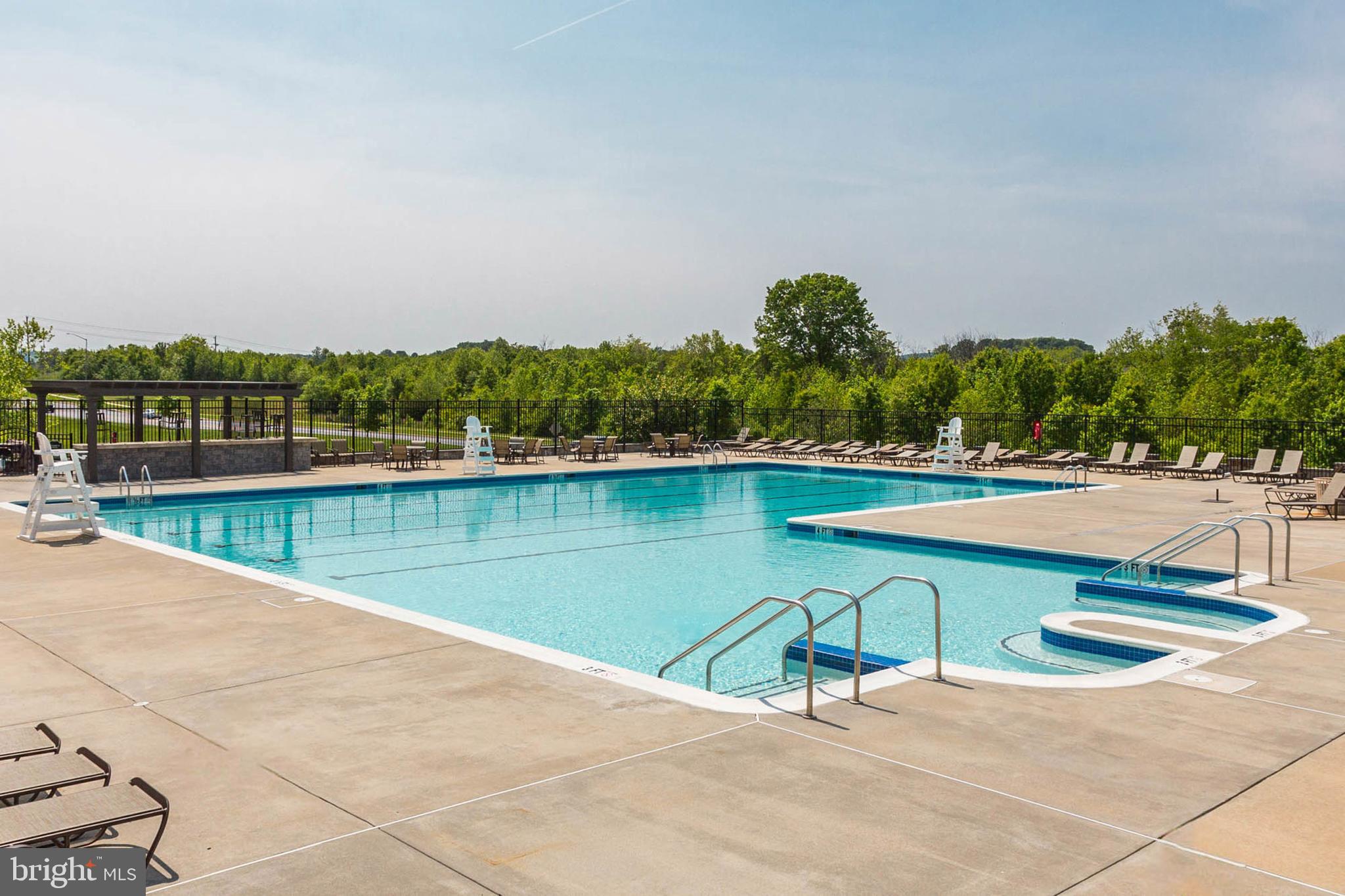 6367 Walcott Lane Frederick, MD 21703 - Photo 39 of 43 a view of a lake with a yard and a large window