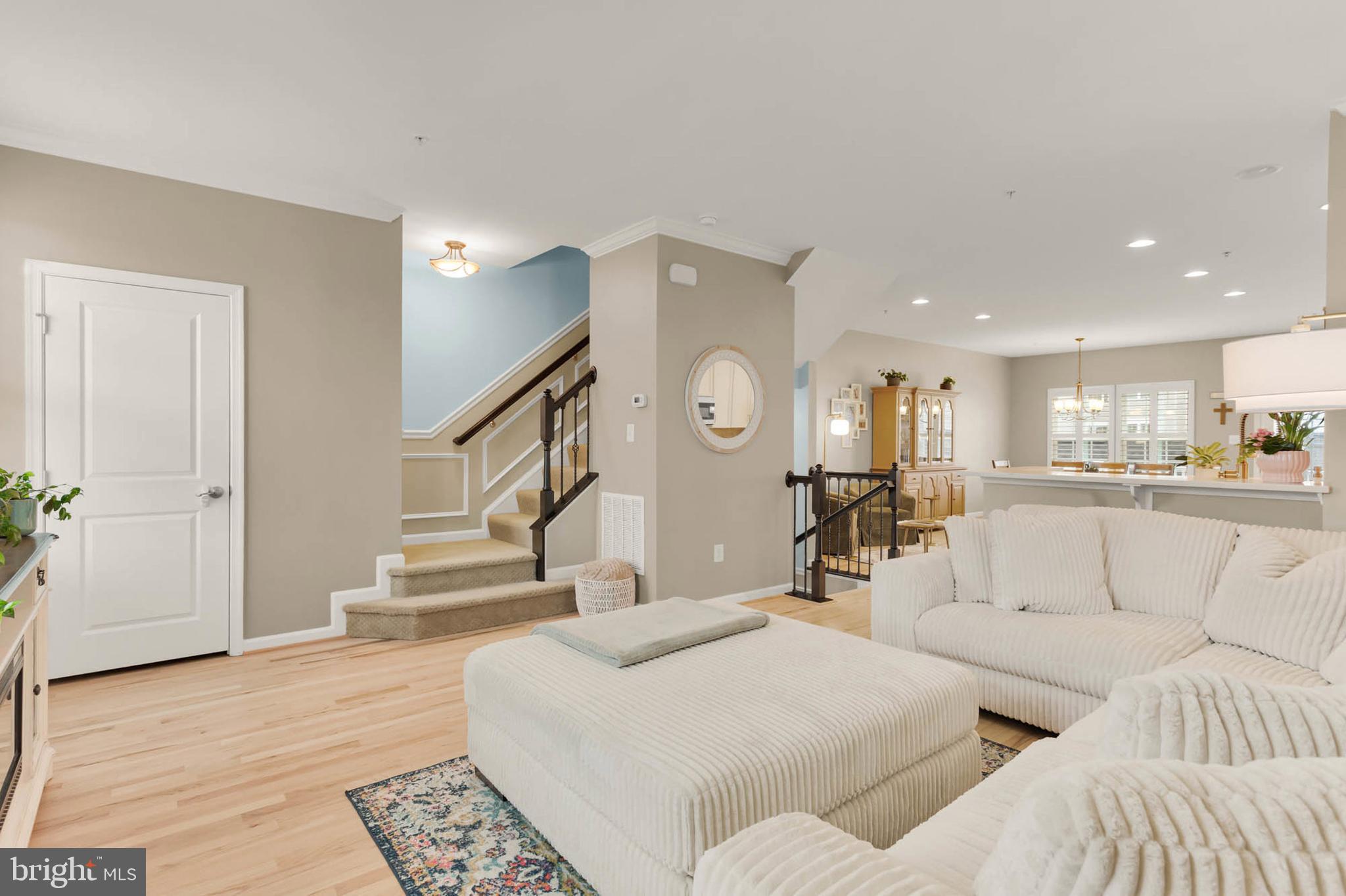 6367 Walcott Lane Frederick, MD 21703 - Photo 6 of 43 a living room with furniture and a view of kitchen
