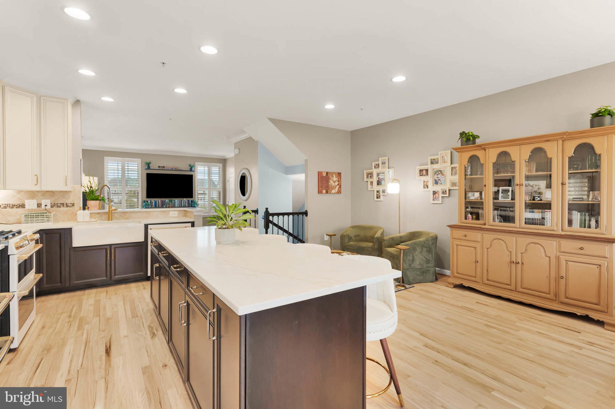 6367 Walcott Lane Frederick, MD 21703 - Photo 10 of 43 a large kitchen with kitchen island a sink a counter space and appliances