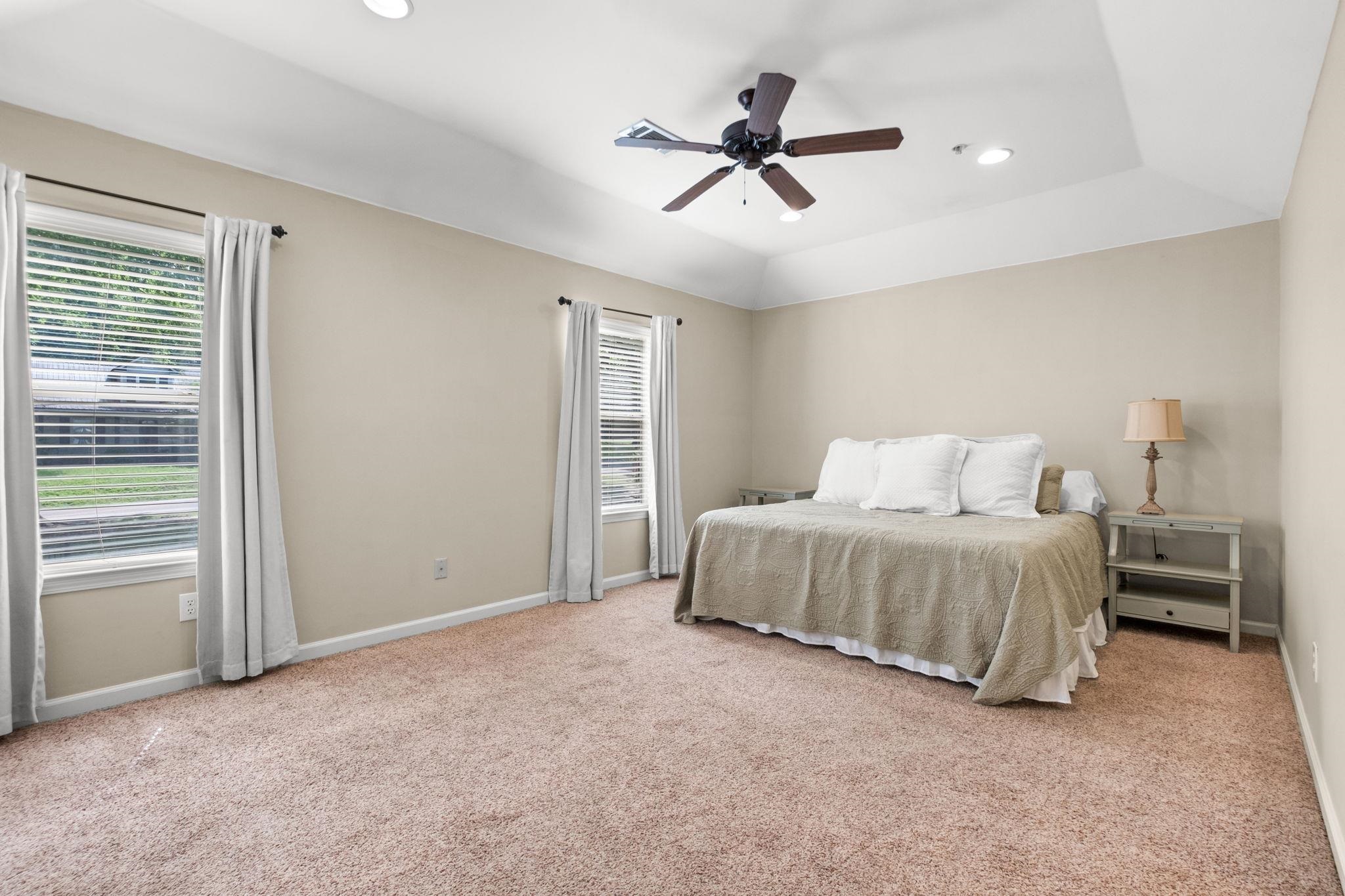 2275 McVay Road, Unit 2275 Germantown, TN 38138 - Photo 26 of 40 a bedroom with a bed and a chandelier