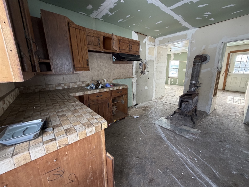 92 Chace Road Freetown, MA 02717 - Photo 2 of 17 a kitchen with stainless steel appliances granite countertop sink stove refrigerator and cabinets