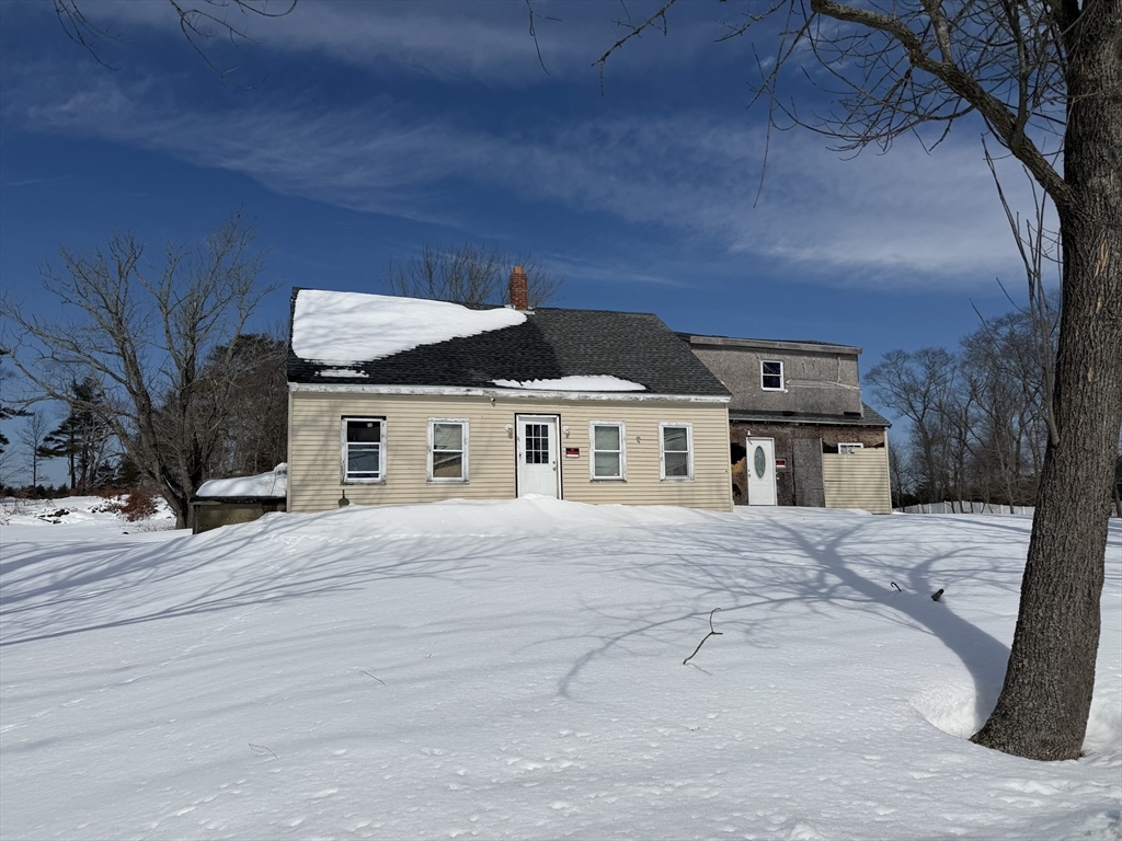 92 Chace Road Freetown, MA 02717 - Photo 6 of 17 a front view of a house with a yard and garage