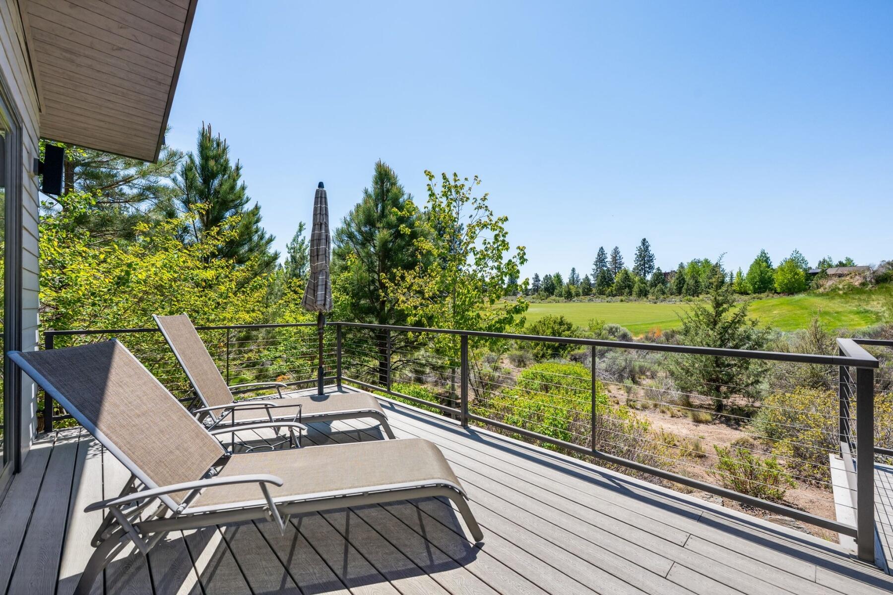 61487 Hackleman Court Bend, OR 97702 - Photo 34 of 35 a view of a balcony with two chairs and a table