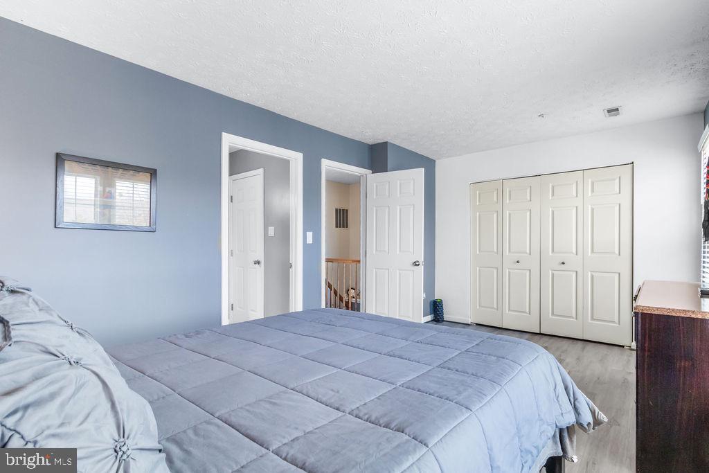8605 Accokeek Street Laurel, MD 20724 - Photo 23 of 44 a bedroom with a large bed closet and closet