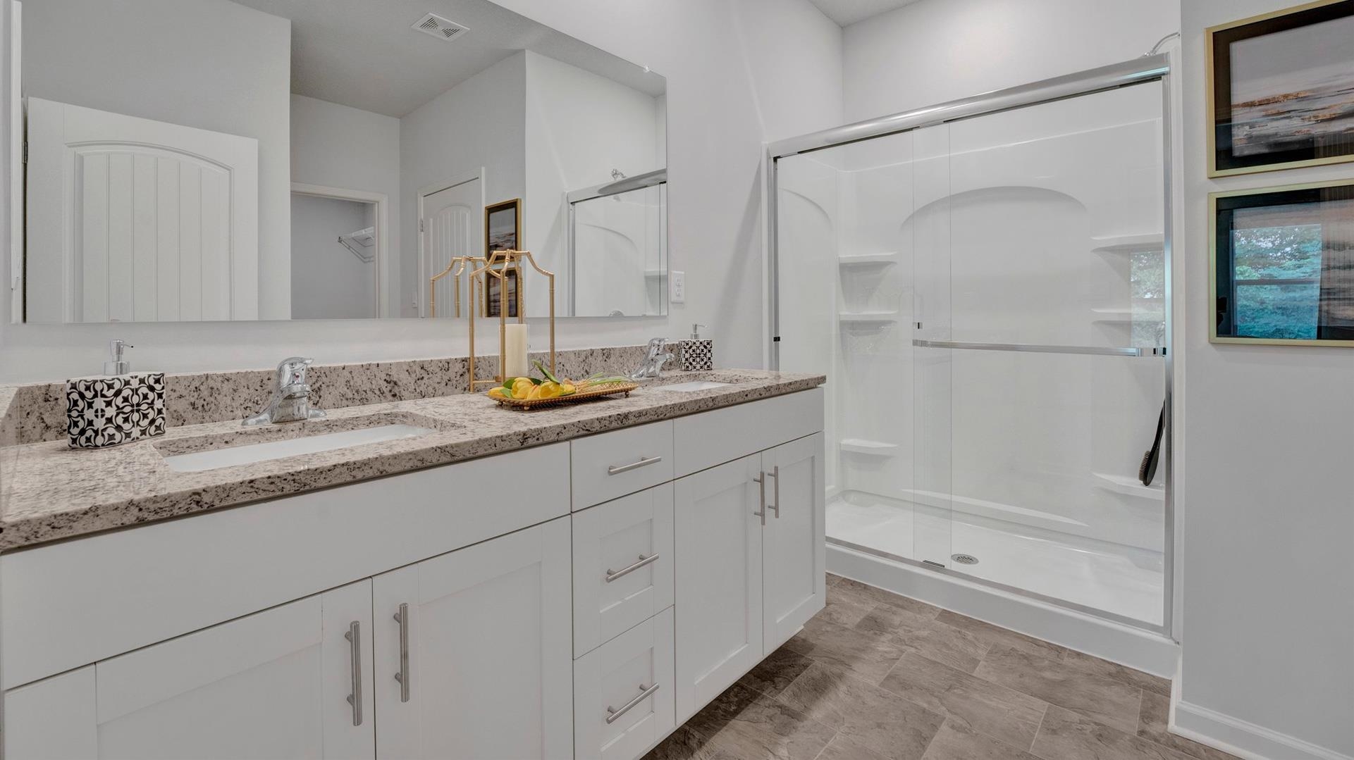 345 Windemere Loop Oakland, TN 38060 - Photo 18 of 23 a bathroom with a granite countertop sink mirror and a