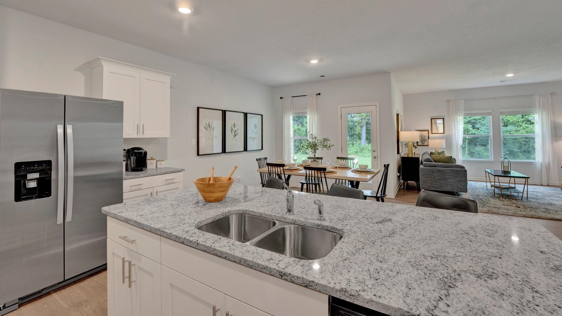 345 Windemere Loop Oakland, TN 38060 - Photo 6 of 23 a kitchen with granite countertop a sink a counter top space appliances and cabinets