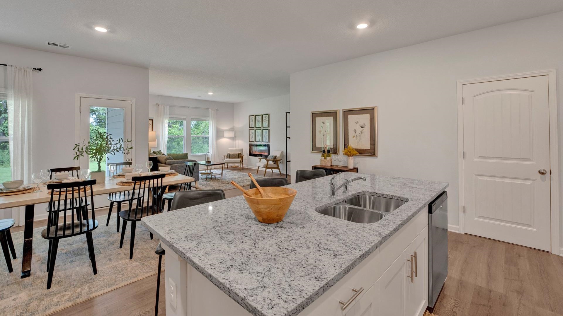 345 Windemere Loop Oakland, TN 38060 - Photo 7 of 23 a kitchen with a sink a counter and chairs
