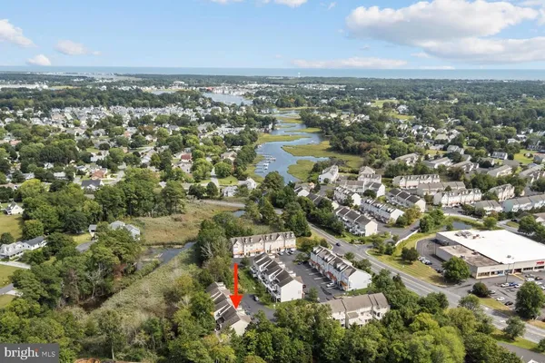 an aerial view of city and lake
