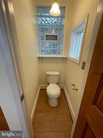 a bathroom with a toilet and a sink
