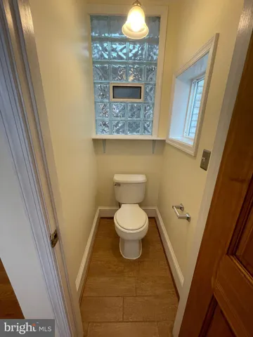 a bathroom with a toilet and a sink