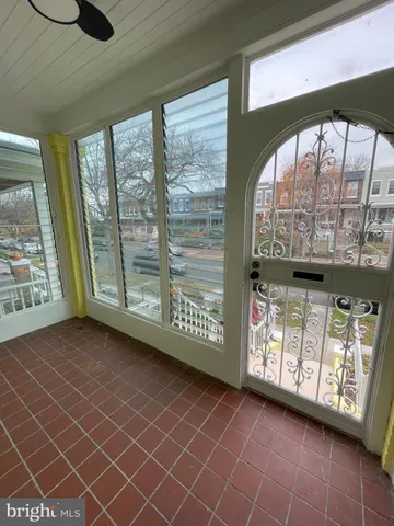 a view of an entryway with a floor to ceiling window