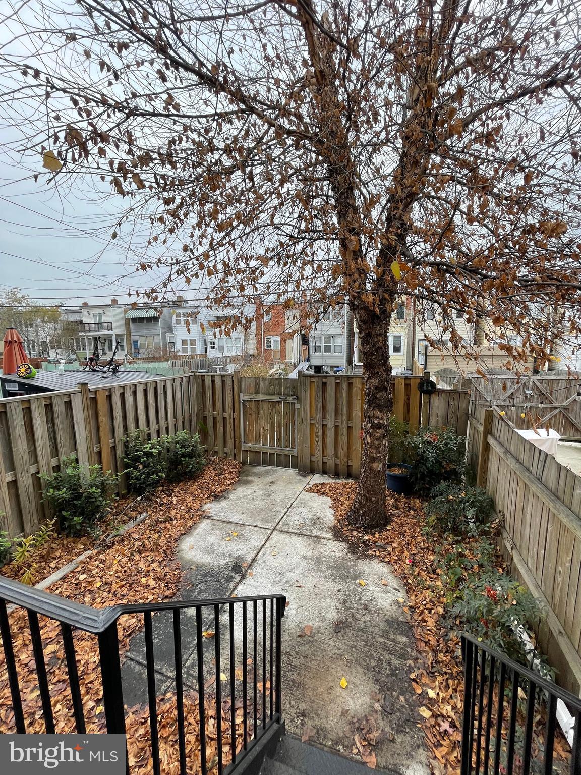 539 24th Street Northeast Washington, DC 20002 - Photo 34 of 37 a view of backyard with wooden fence and trees