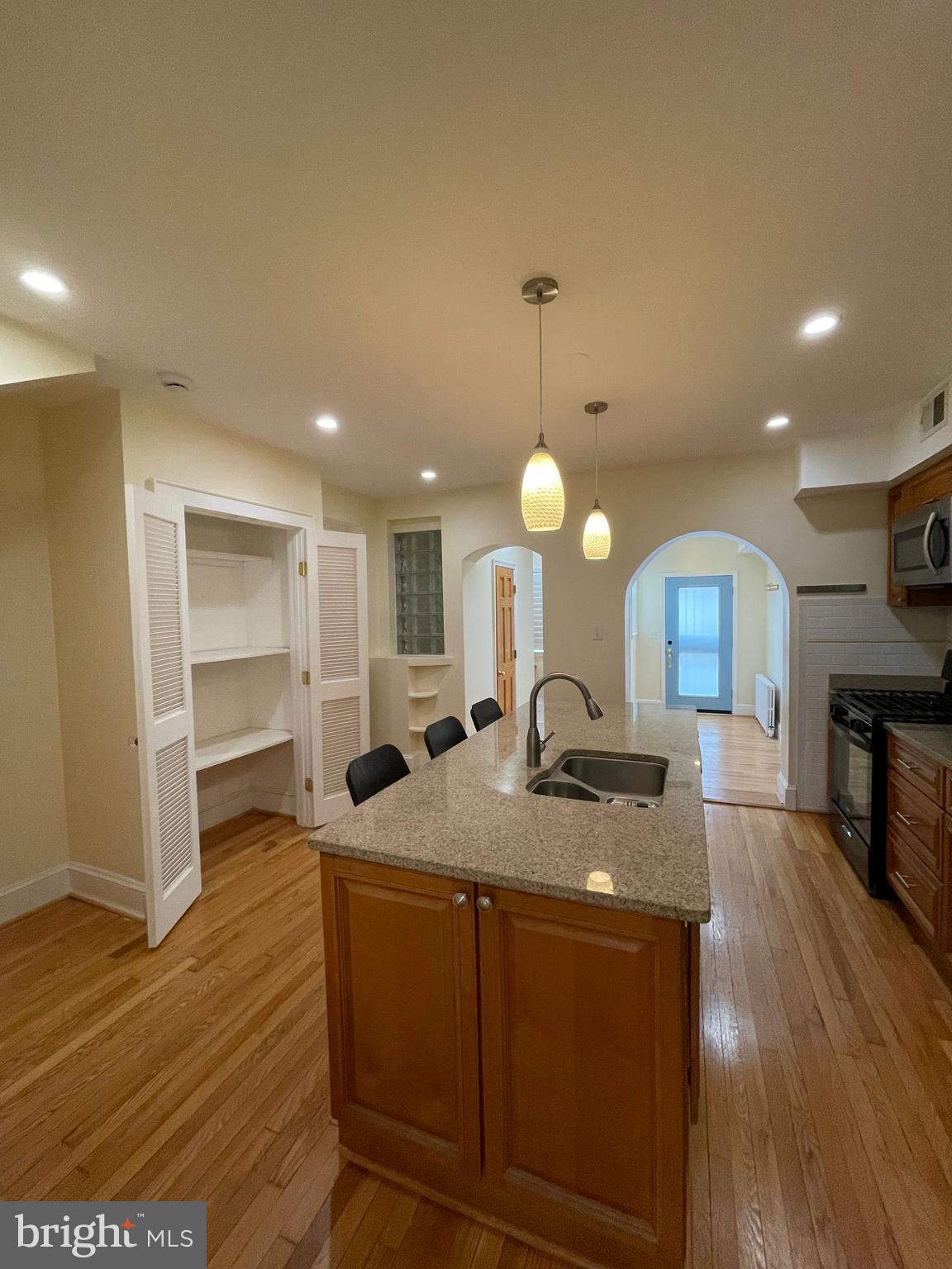539 24th Street Northeast Washington, DC 20002 - Photo 10 of 37 a kitchen with sink refrigerator and microwave