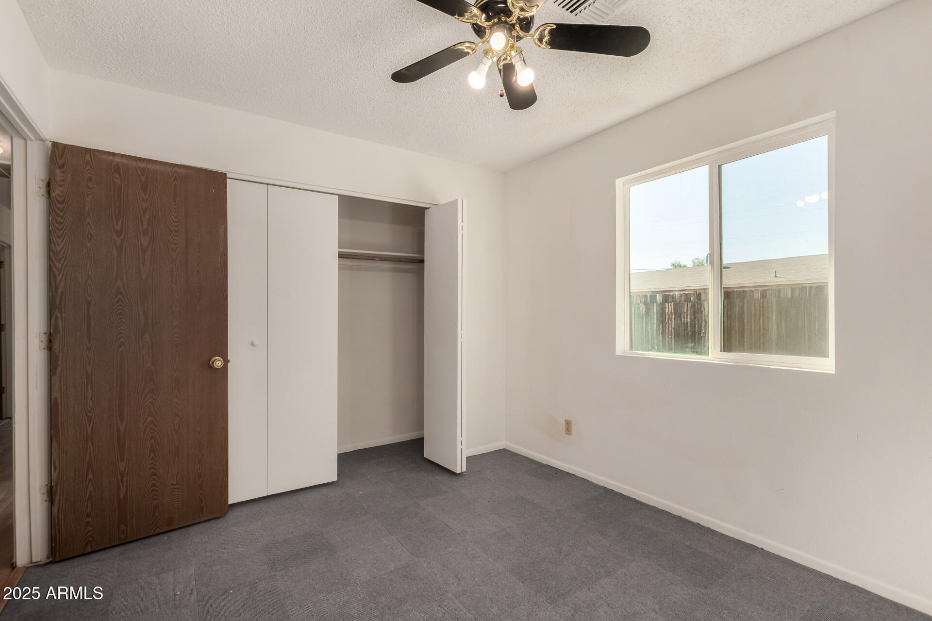 301 South Elmont Drive Apache Junction, AZ 85120 - Photo 12 of 32 a view of an empty room with a window