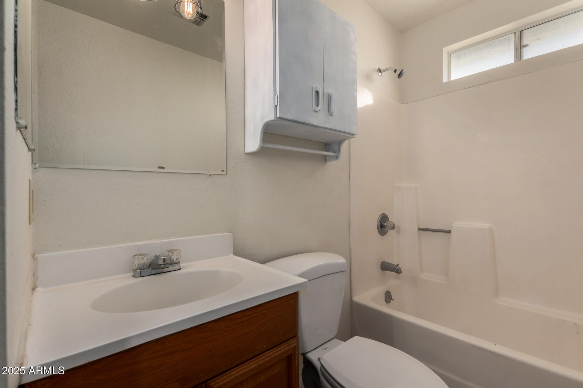 301 South Elmont Drive Apache Junction, AZ 85120 - Photo 14 of 32 a bathroom with a sink toilet and bathtub