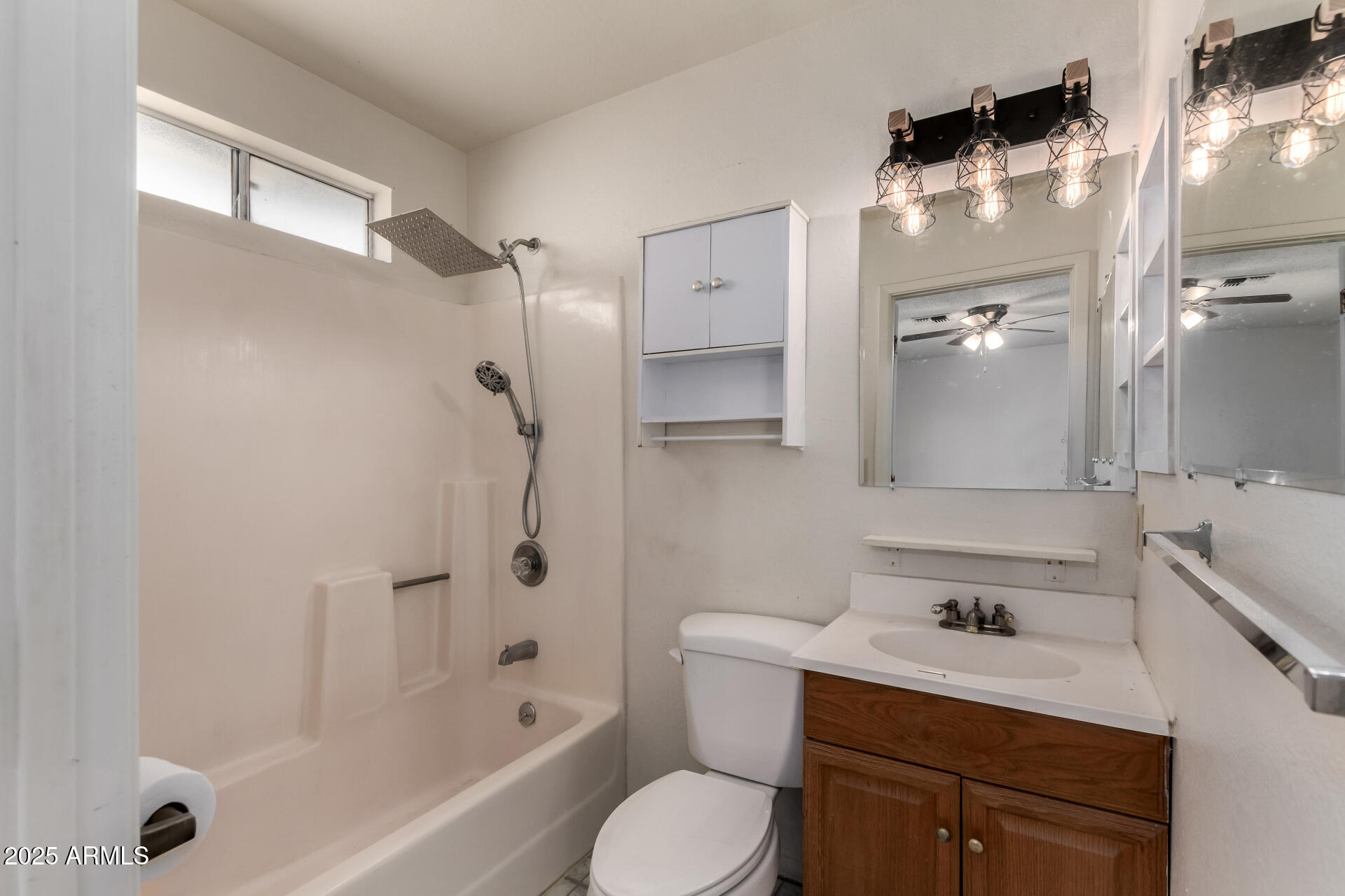 301 South Elmont Drive Apache Junction, AZ 85120 - Photo 17 of 32 a bathroom with a sink vanity granite toilet tub and shower