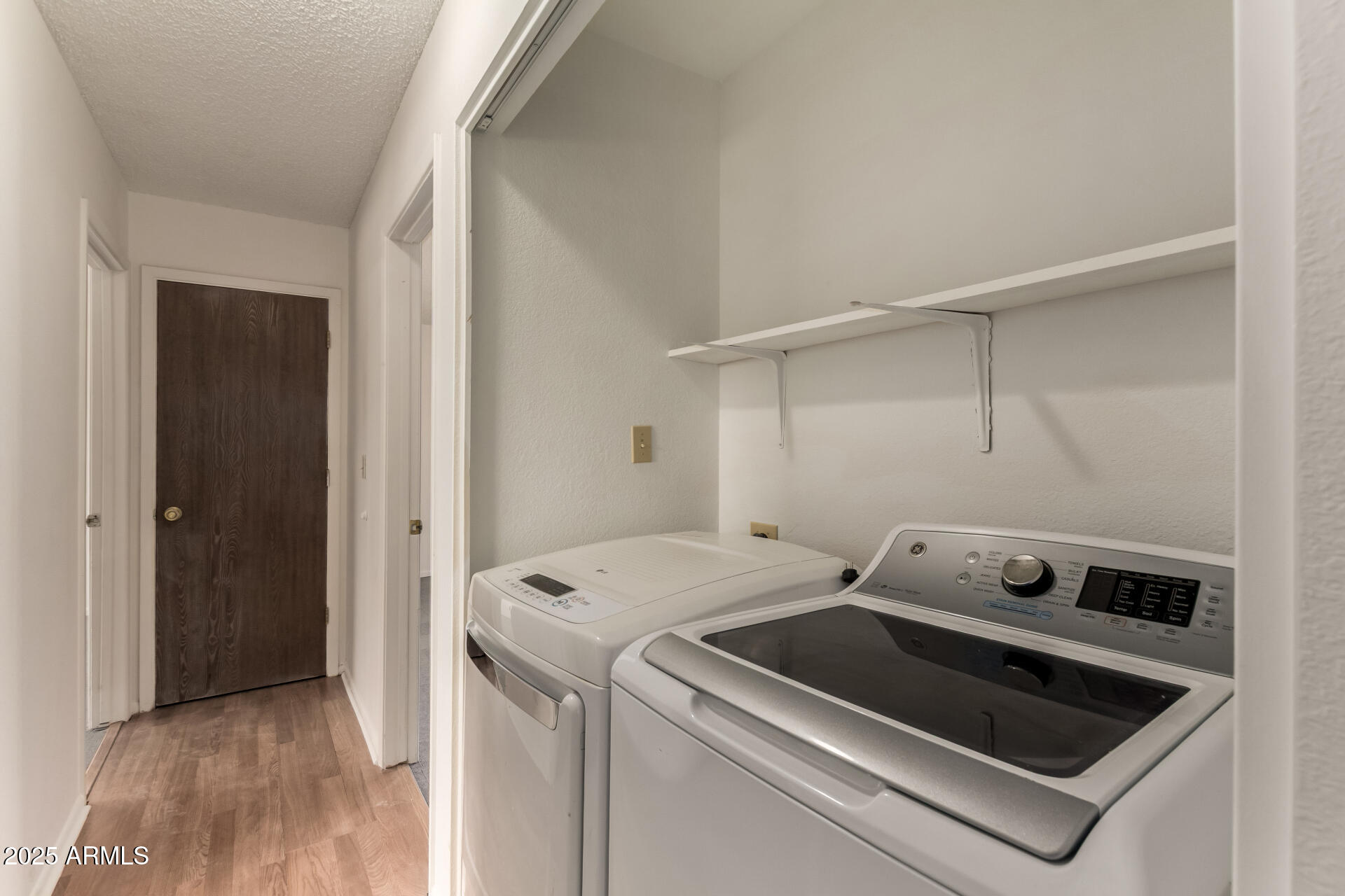 301 South Elmont Drive Apache Junction, AZ 85120 - Photo 18 of 32 a utility room with dryer and washer