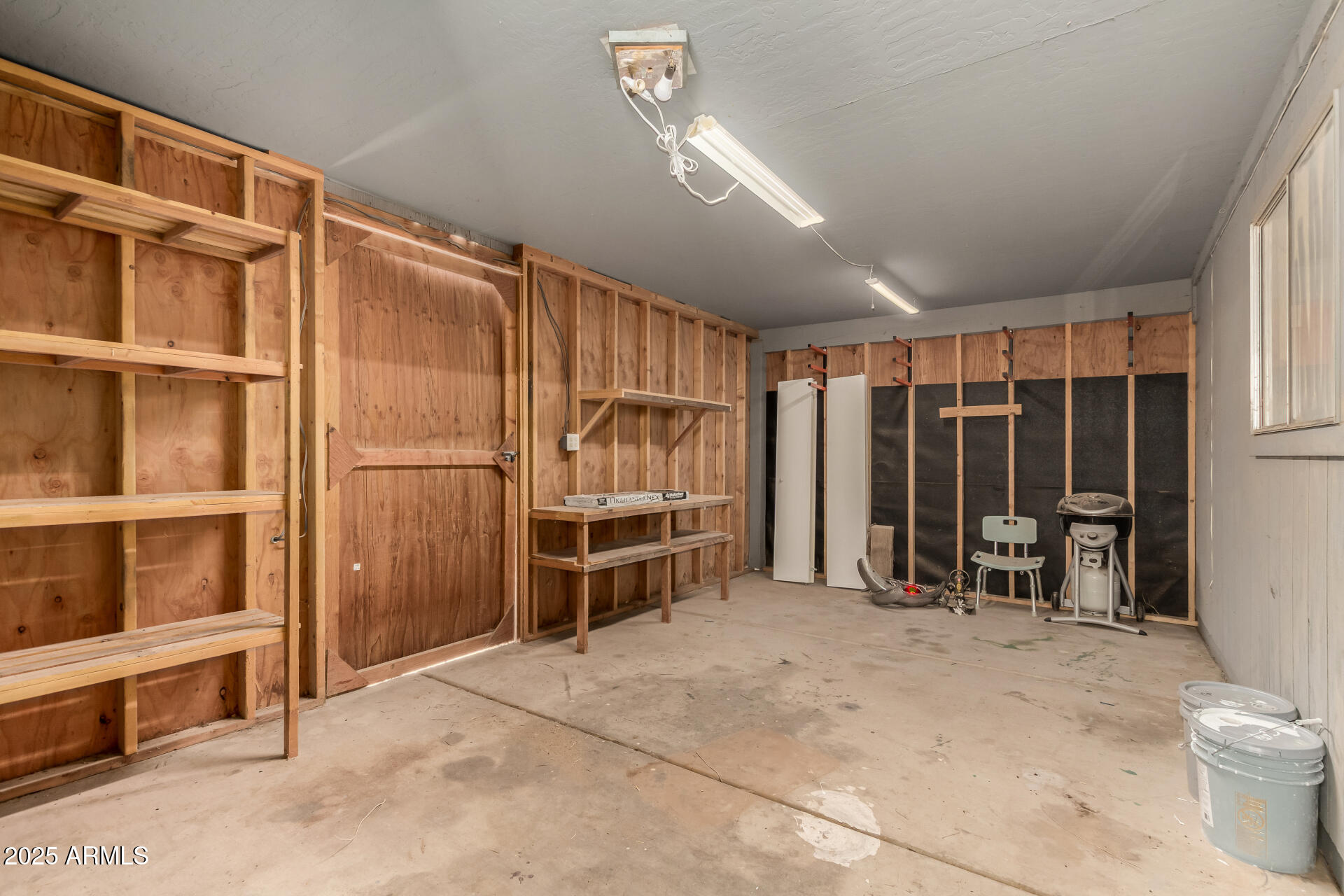 301 South Elmont Drive Apache Junction, AZ 85120 - Photo 20 of 32 a view of an empty room with furniture and a window