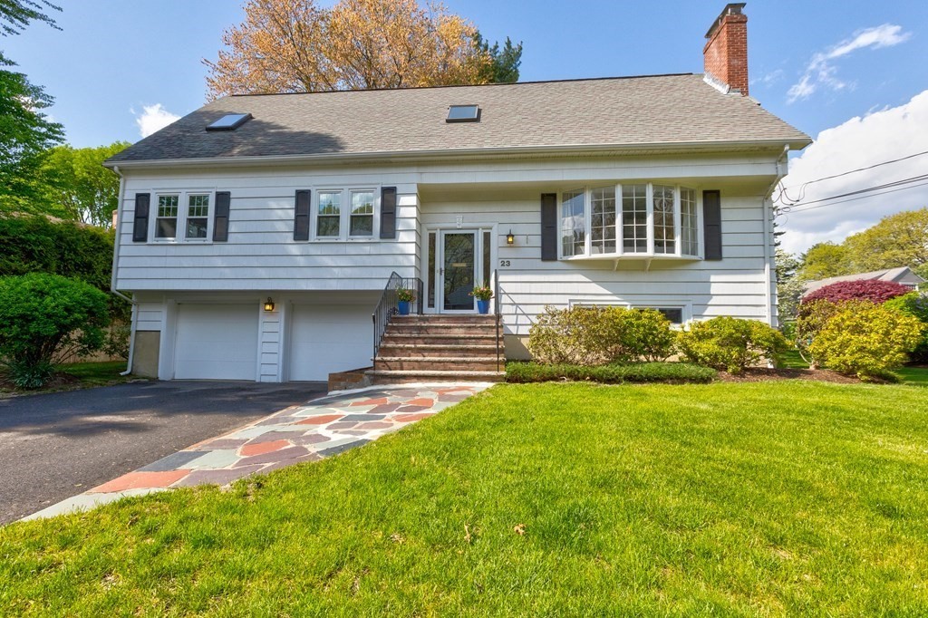 23 Bonwood Road Needham, MA 02492 - Photo 1 of 28 a front view of a house with a garden and yard