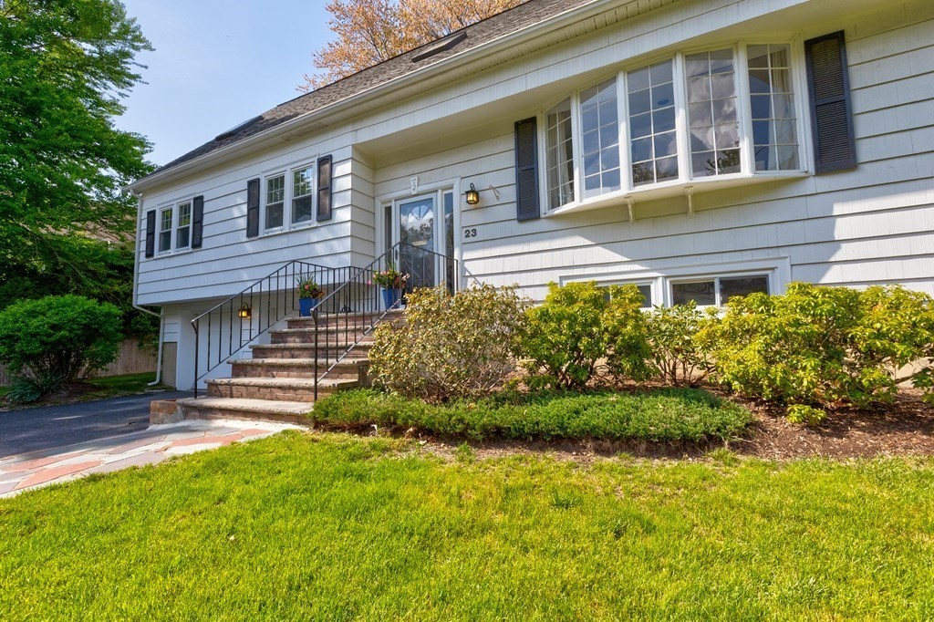 23 Bonwood Road Needham, MA 02492 - Photo 3 of 28 a front view of a house with a garden