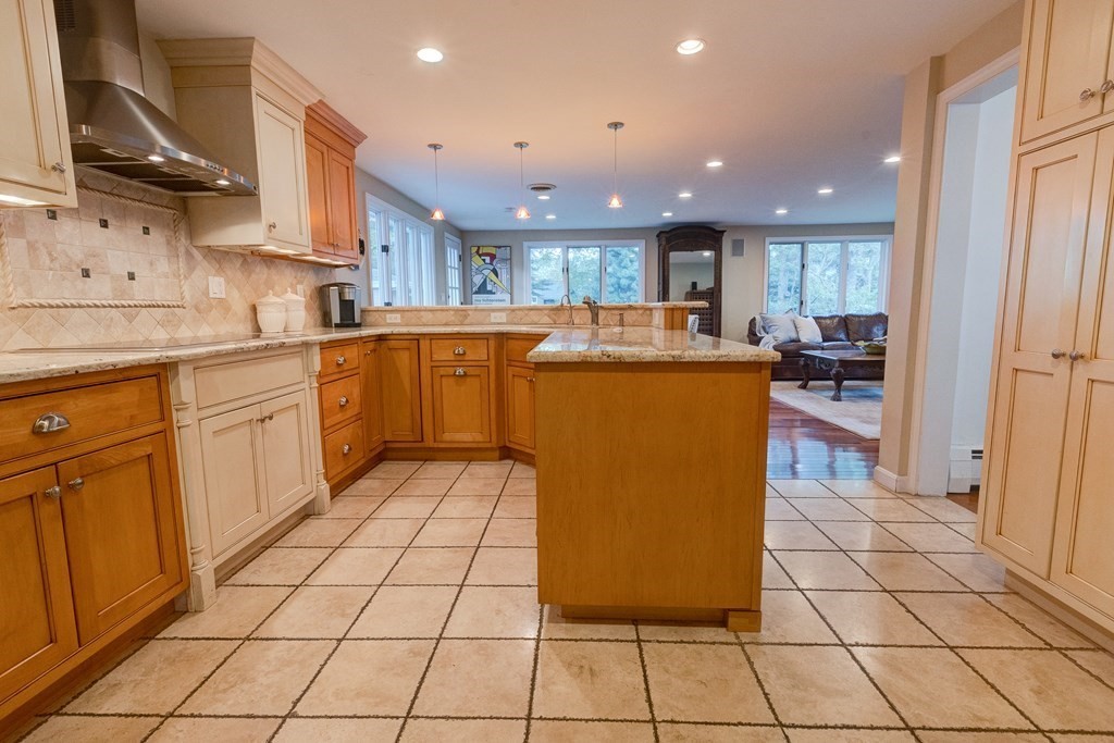 23 Bonwood Road Needham, MA 02492 - Photo 8 of 28 a kitchen with a sink a counter top space cabinets and stainless steel appliances