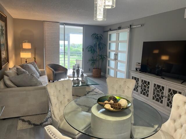 6461 Northwest 2nd Avenue, Unit 409 Boca Raton, FL 33487 - Photo 9 of 61 a living room with furniture and a flat screen tv