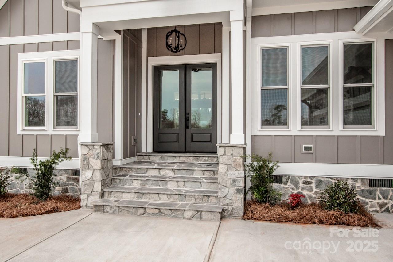 6098 Ballard Road Denver, NC 28037 - Photo 11 of 48 a front view of a house with a yard