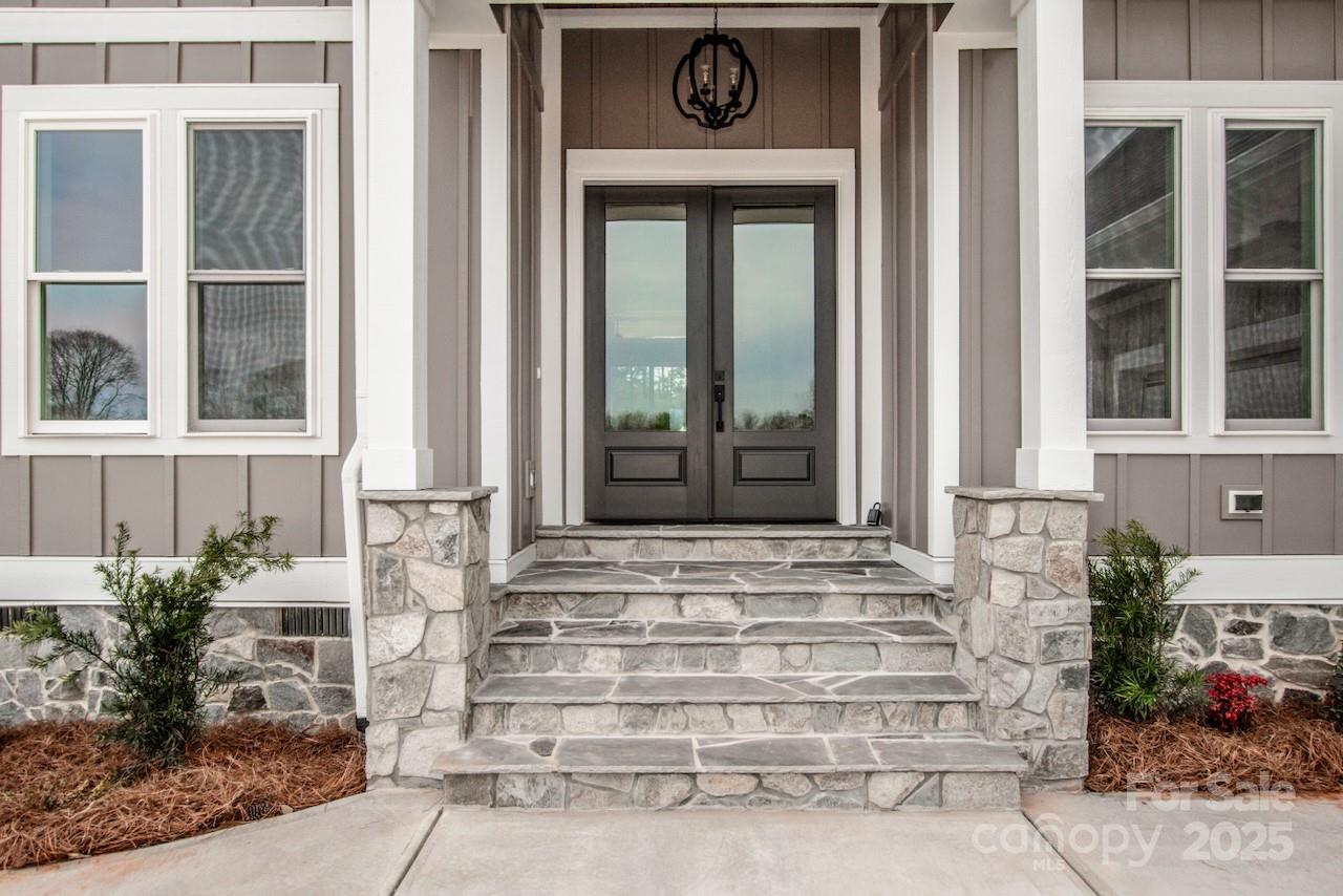 6098 Ballard Road Denver, NC 28037 - Photo 12 of 48 a front view of a house with a yard